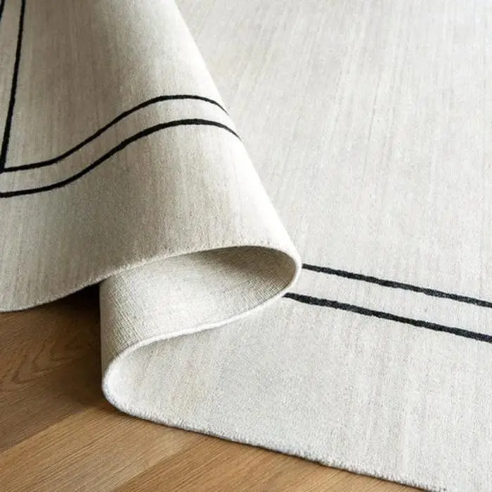 Pearl With Black Bordered Carpet img 1